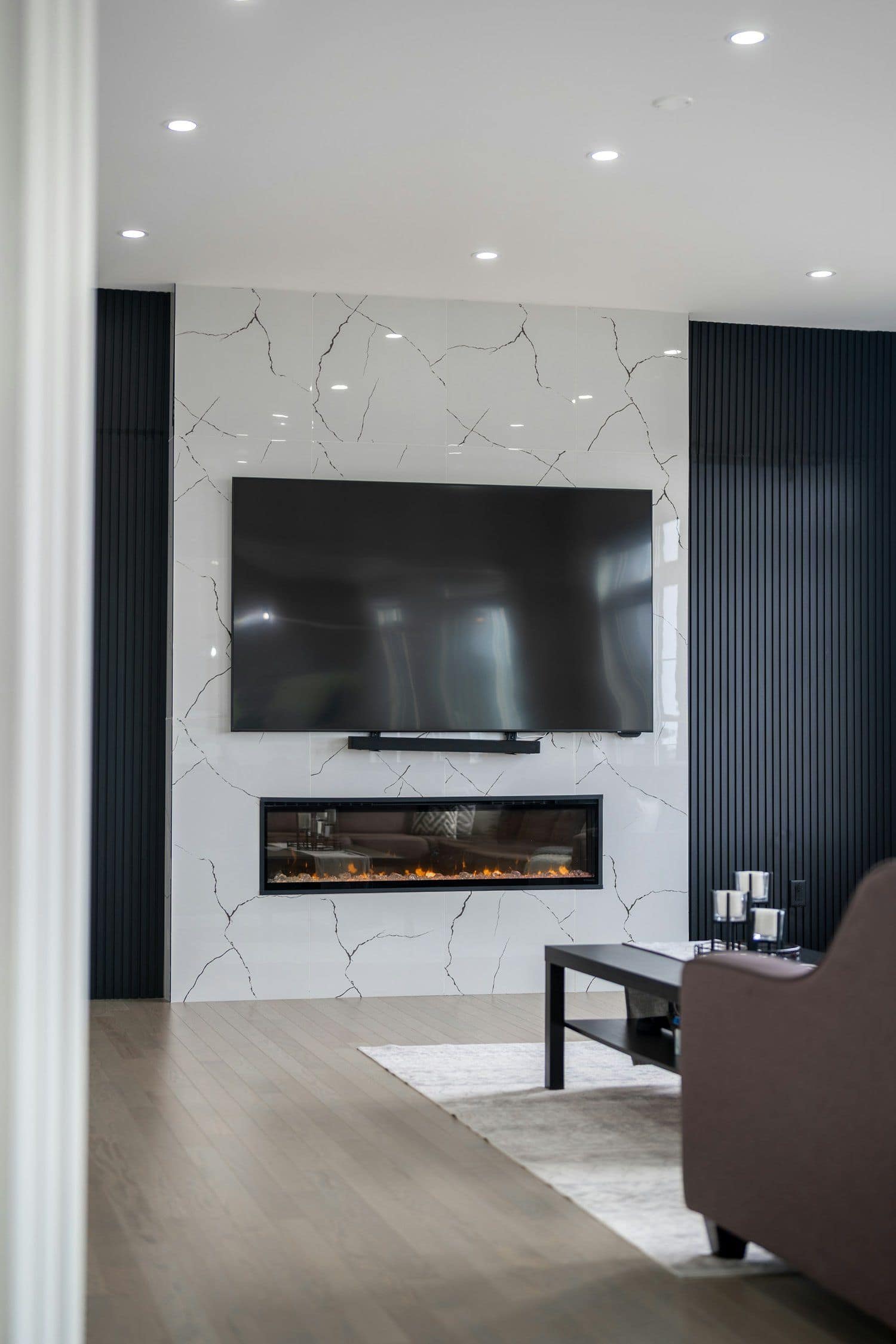 Finished basement lounge with warm lighting