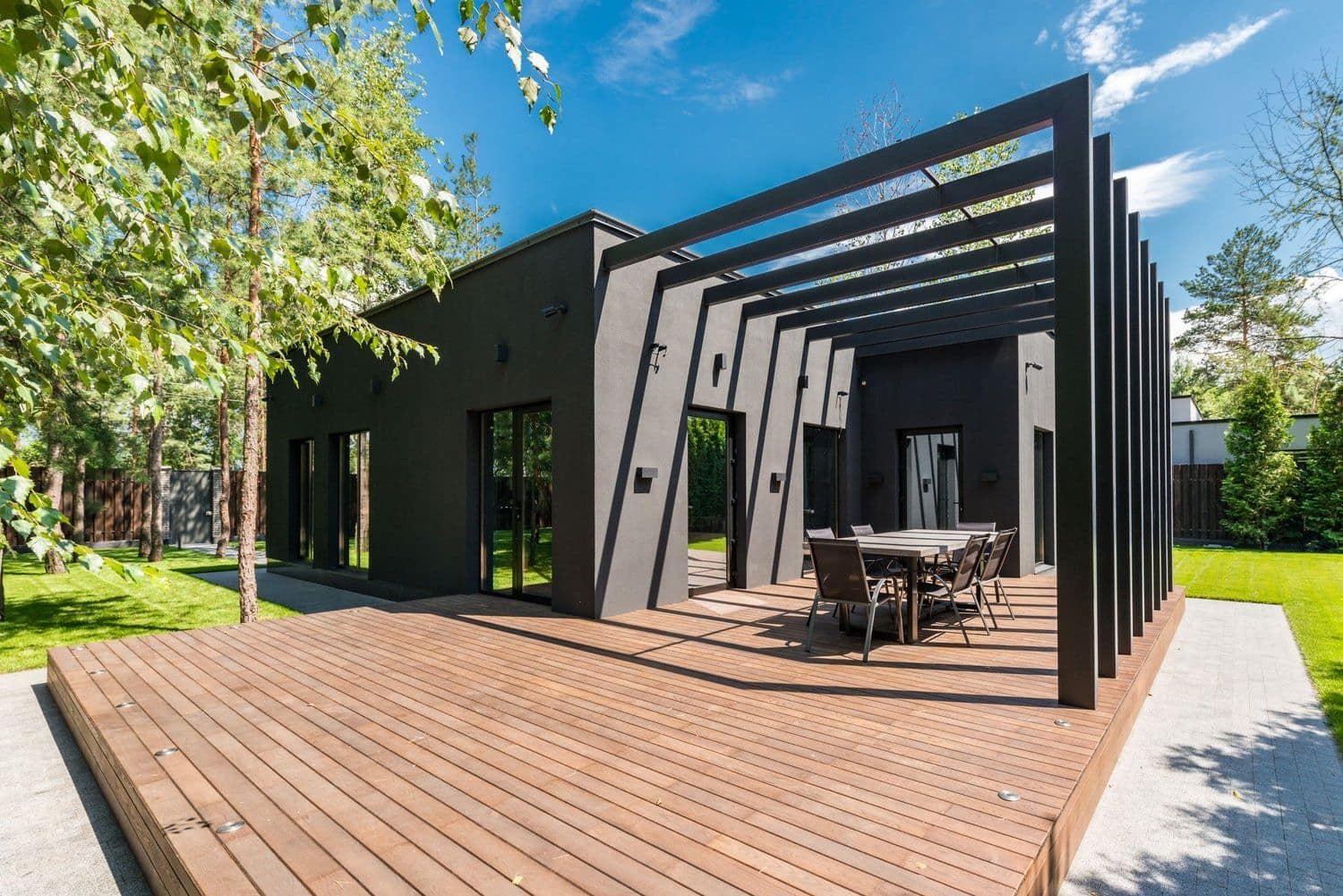 Custom wooden deck and fence in a residential backyard
