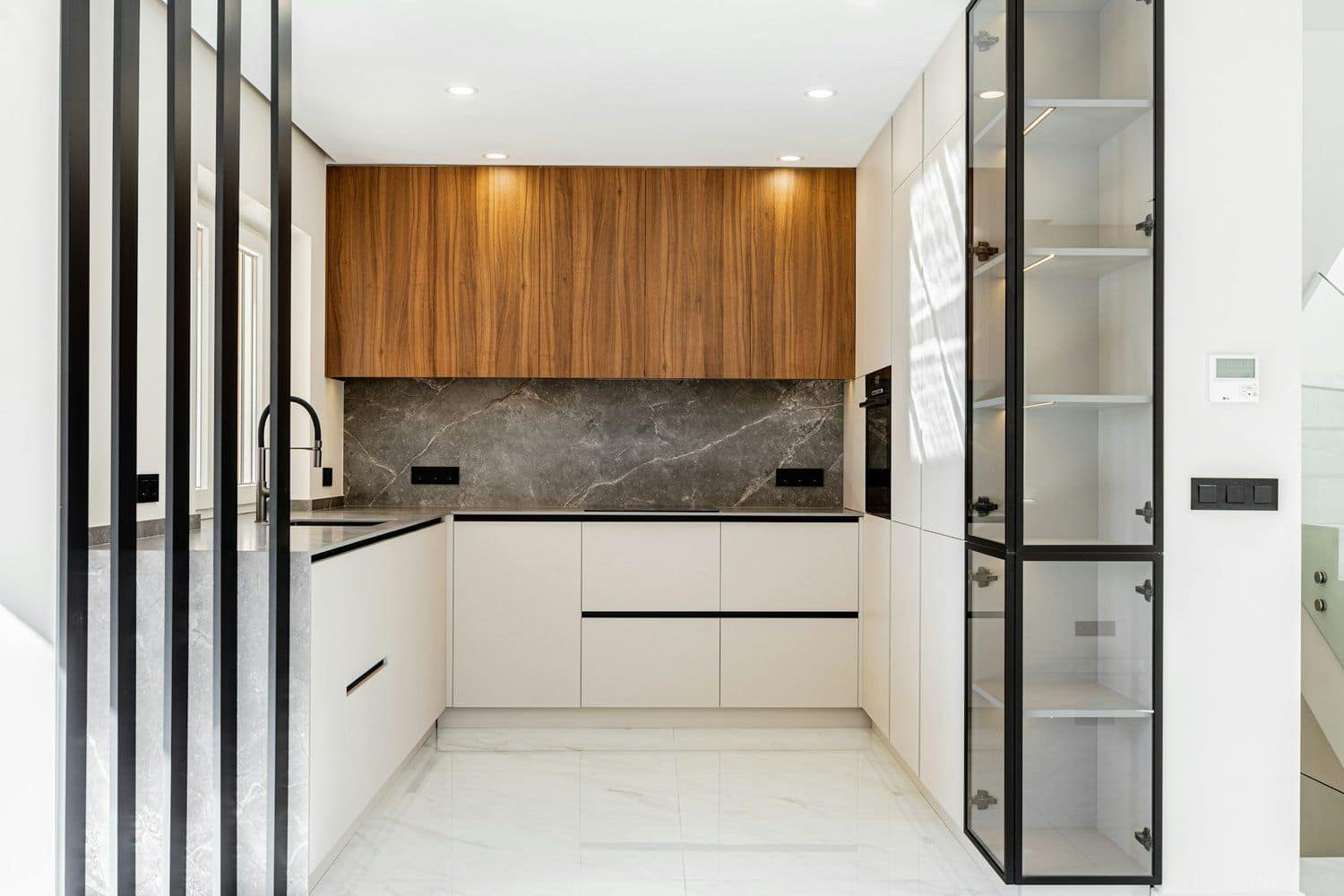 Luxury kitchen with premium cabinetry and marble countertops