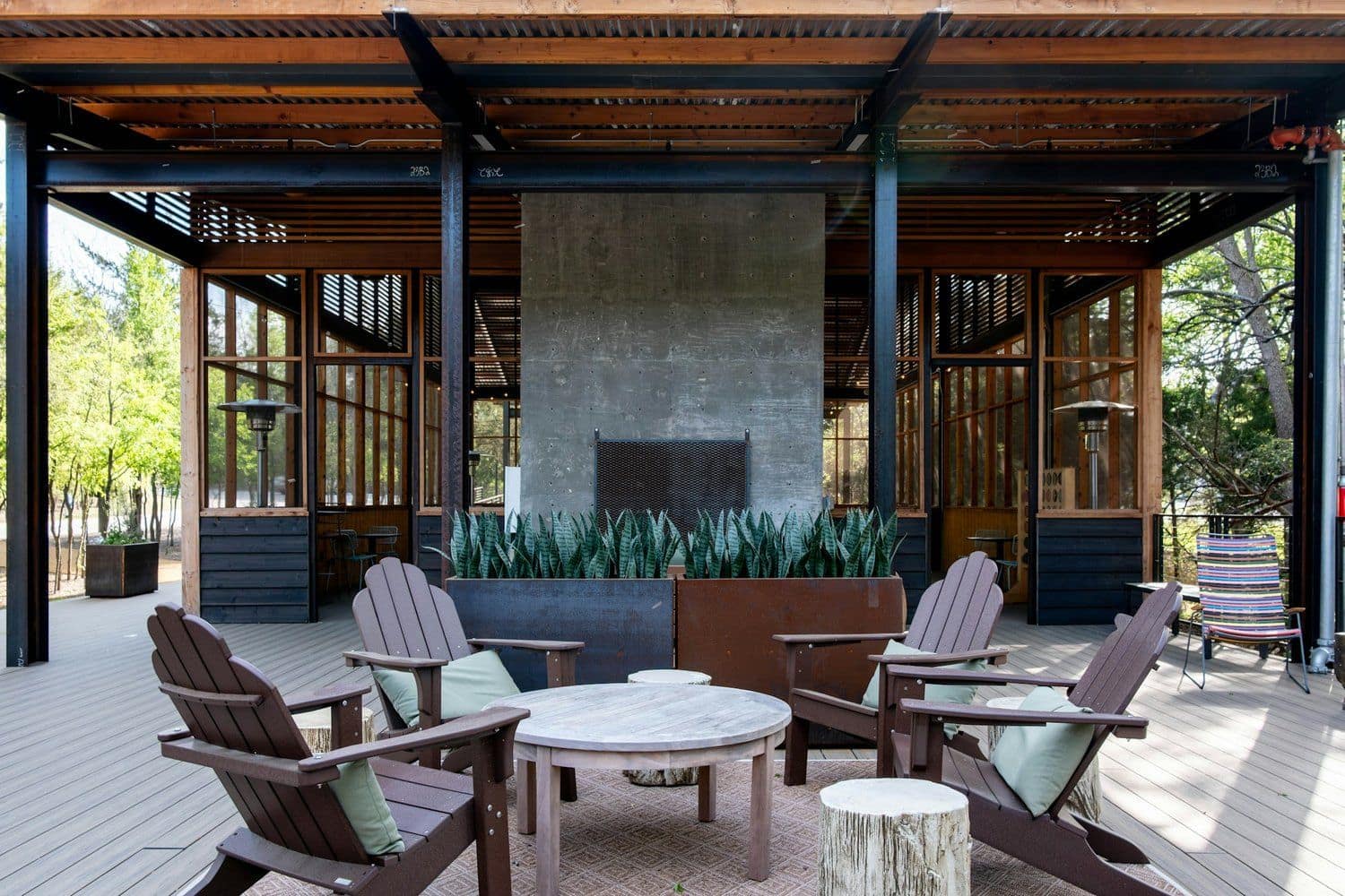 Outdoor living space with fireplace and lounge seating