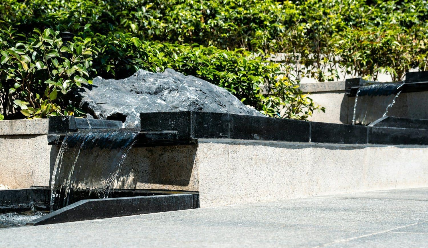 Custom stone waterfall water feature with lighting